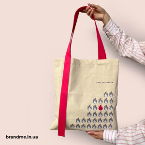 Брендований шопер із унікальним дизайном — стиль та індивідуальність для вашої команди Бежевий шопер із рожевими ручками та принтом “Сила спільноти”